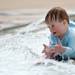 21-month-old Michael Hansen, of Dexter, plays in the water while beating the heat at Veterans Memorial Park Pool on Tuesday afternoon.  Melanie Maxwell I AnnArbor.com